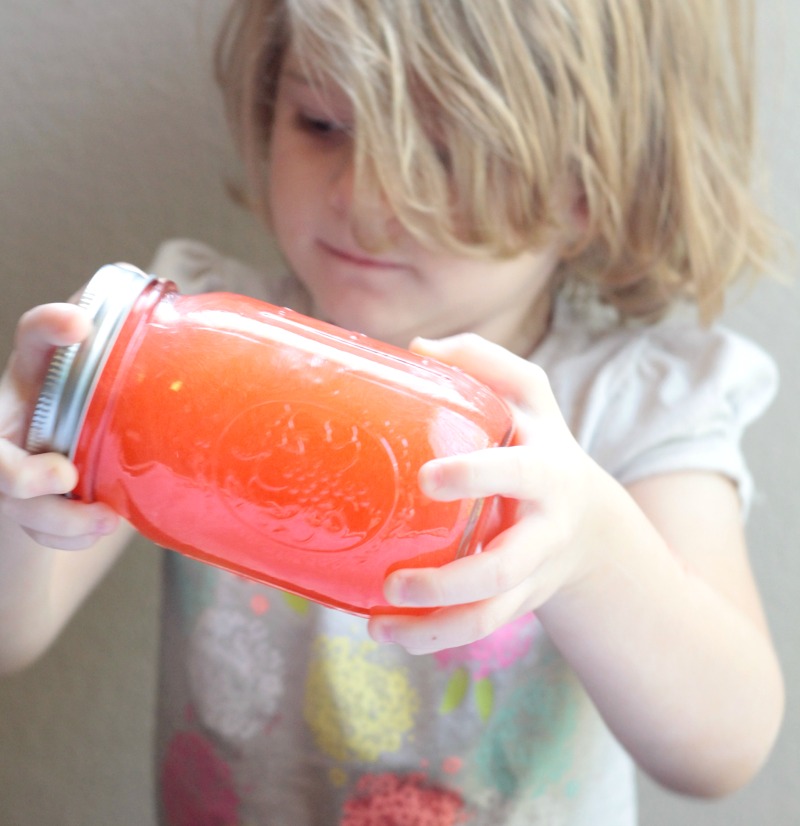 preschooler mixing oil and water