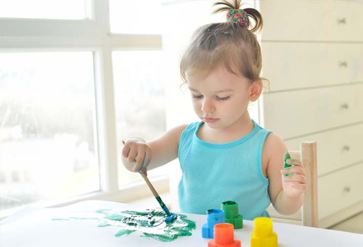 young girl painting